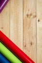 Colorful vinyl rolls on wooden background