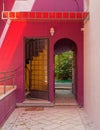 Colorful violet house entrance with secret garden, Athens Greece
