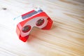 Colorful virtual reality glasses for phone on wooden background