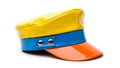Colorful visor cap with yellow, blue, and orange sections Royalty Free Stock Photo