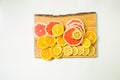 Colorful vitamin C fruits on woden cutting board