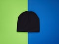 Colorful vivid kids hat. Demi season autumn children`s fashion wear. Top view on blue green background