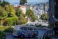 colorful Volkswagen T2 hippie van driving down Lombard Street