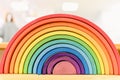 Colorful Waldorf wooden rainbow in a montessori teaching pedagogy classroom