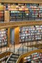 Colorful wall of books on the shelfs at the rotunda in Stockholm Stadsbibliotek or Public Library Royalty Free Stock Photo