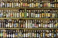 Colorful wall of Cachaca bottles, typical drink in Paraty, Brazil