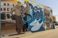 A colorful wall mural of Malcolm Chicken Hicks at the Carolina Beach Boardwalk in Carolina Beach North Carolina