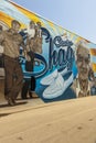 A colorful wall mural of Malcolm Chicken Hicks at the Carolina Beach Boardwalk in Carolina Beach North Carolina