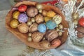 Colorful walnuts in the wooden bowl