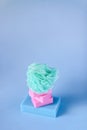 Colorful washcloths and bars of soap on a blue background. Accessories for body care and hygiene