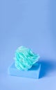 Colorful washcloths on a blue background. Accessories for body care and hygiene