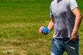 Colorful water bombs in summer ready to play. Holding balloons in hand Royalty Free Stock Photo
