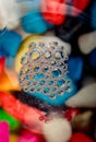 Colorful water bubbles on a glass ground