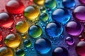 Colorful water droplets create a vibrant pattern on a textured surface in bright light Royalty Free Stock Photo