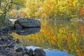 Colorful water reflection on the Pigeon River in fall. Royalty Free Stock Photo