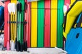 Colorful water sport storage with paddles in the front door