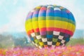 Colorful watercolor painting balloon above a flower field at a national balloon festival