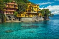 Colorful waterfront houses with beautiful azure blue beach, Portofino, Italy Royalty Free Stock Photo