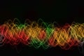 Colorful wave, tangled threads, on a black background