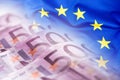 Colorful waving european union flag on a euro money background Royalty Free Stock Photo