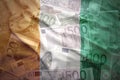 Colorful waving ivorian flag on a euro background