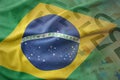 Colorful waving national flag of brazil on a euro money banknotes background. Royalty Free Stock Photo