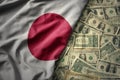 colorful waving national flag of japan on a american dollar money background. finance concept Royalty Free Stock Photo