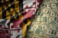 colorful waving national flag of maryland state on a american dollar money background. finance concept Royalty Free Stock Photo