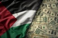 colorful waving national flag of palestine on a american dollar money background. finance concept Royalty Free Stock Photo