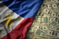 colorful waving national flag of philippines on a american dollar money background. finance concept