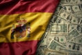 colorful waving national flag of spain on a american dollar money background. finance concept Royalty Free Stock Photo