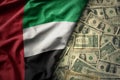 colorful waving national flag of united arab emirates on a american dollar money background. finance concept Royalty Free Stock Photo