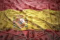 Colorful waving spanish flag on a dollar money background Royalty Free Stock Photo