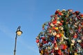 Colorful wedding padlocks on a metal tree against blue sky Royalty Free Stock Photo
