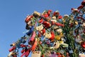 Colorful wedding padlocks on a metal tree against blue sky Royalty Free Stock Photo