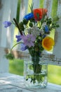 Little wild flower bouquet on a garden bench Royalty Free Stock Photo