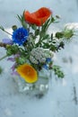 Little wild flower bouquet on a garden bench Royalty Free Stock Photo