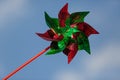 Colorful wind vane with sky as background