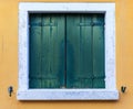 Colorful window of a house on the Venetian island of Burano, Venice. Facade of the houses of Burano close-up. Venice, Italy.