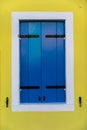 Colorful window of a house on the Venetian island of Burano, Venice. Facade of the houses of Burano close-up. Venice, Italy