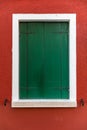 Colorful window of a house on the Venetian island of Burano, Venice. Facade of the houses of Burano close-up. Venice, Italy