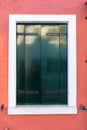 Colorful window of a house on the Venetian island of Burano, Venice. Facade of the houses of Burano close-up. Venice, Italy Royalty Free Stock Photo