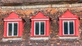 Colorful windows and roof tiles on a house in Sighisoara Royalty Free Stock Photo