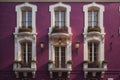 Colorful windows of a typical house in the city, ai generative