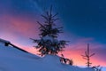 Colorful winter alpine landscape at night with starry sky and glow of sunset Royalty Free Stock Photo