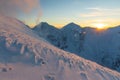 Colorful winter sunset in West Tatras Mountains. View from Volovec to the Rohace. Colorful sky and illuminated by the sun snow in