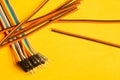 Colorful wires isolated on yellow background. connection wire for electrical schemes. copy space Royalty Free Stock Photo