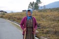 Colorful Woman Pauses From Her Work in Rural Bhutan
