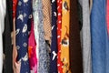 Colorful Woman's Clothing Fabric Hanging in Closet