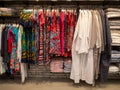 colorful women clothing dress, wardrobe and t-shirts hang on hangers inside of shopping mall Royalty Free Stock Photo